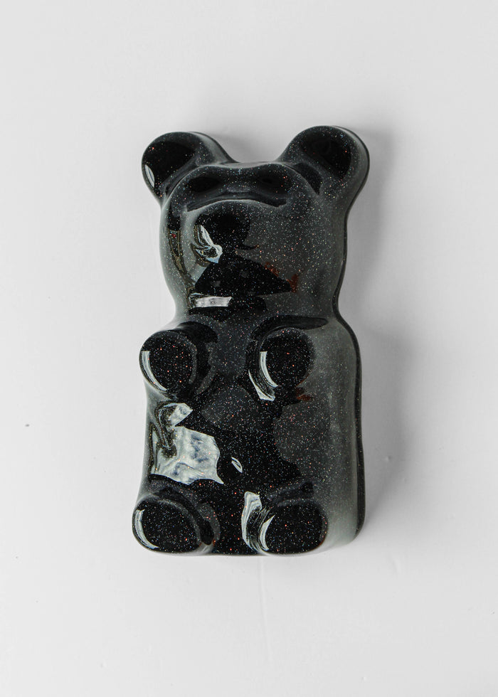 Galactic Black Gummy Bear by Olivia Bonilla — original plaster, automotive paint, and resin sculpture, 5×10×5 in. Midnight Gallery.