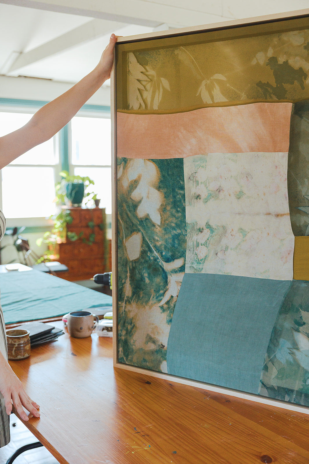 Running Away From a Tame Life by Kristen Abbott — original cyanotype, eco print, and oil stick on various textiles, 32×42×2 in, framed. Midnight Gallery.