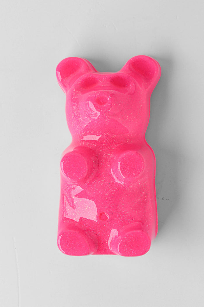 Hot Pink Gummy Bear by Olivia Bonilla — original plaster, automotive paint, and resin sculpture, 5×10×5 in. Midnight Gallery.