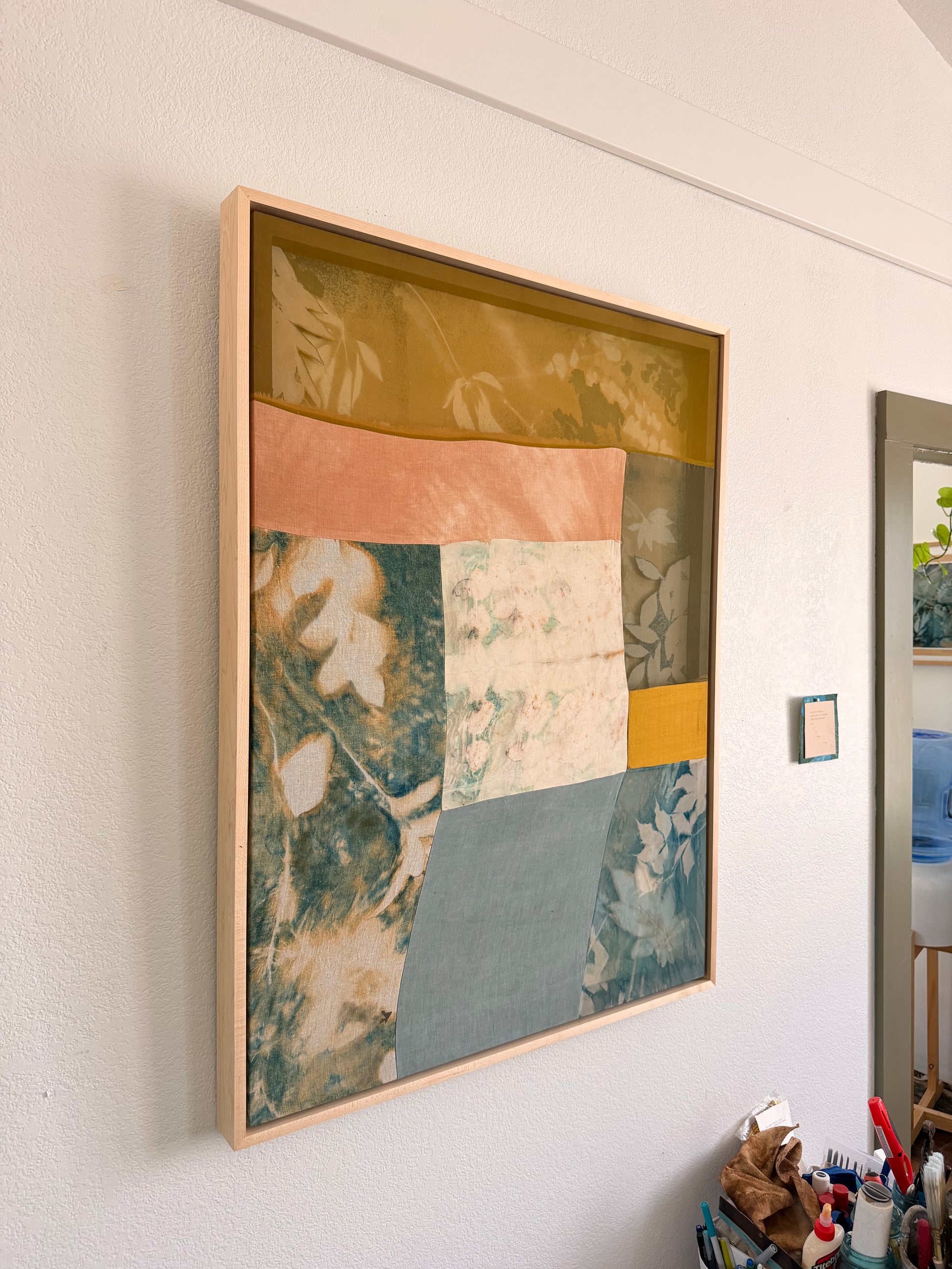 Running Away From a Tame Life by Kristen Abbott — original cyanotype, eco print, and oil stick on various textiles, 32×42×2 in, framed. Midnight Gallery.
