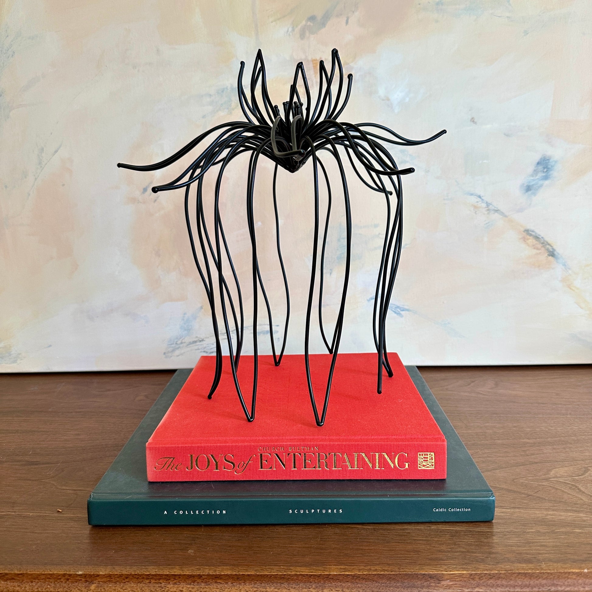 Still Unfolding by Emily Meisler — original welded steel sculpture, 13×13×13 in. Midnight Gallery.