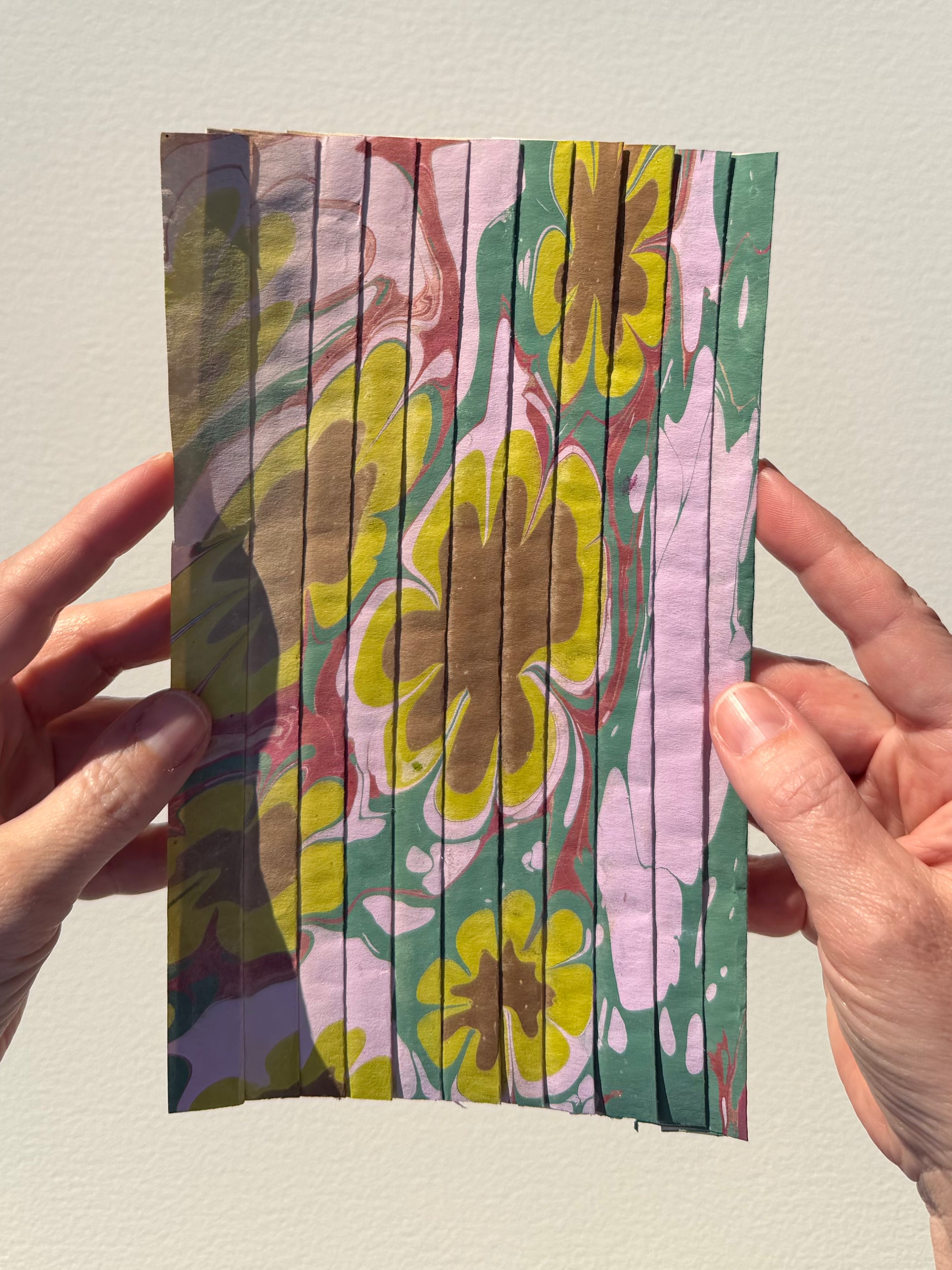 Ebru Pleat XII by Morgan Elvington Walker — original marbling on pleated newsprint paper, 6×9 in. Midnight Gallery.